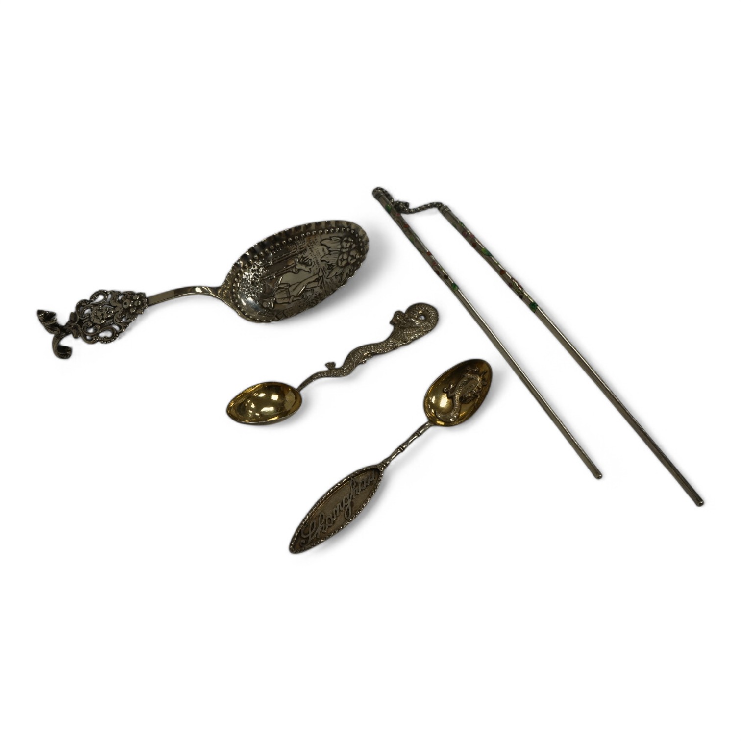 An early 19th century continental silver spoons, with embossed bowl and pieced terminal, import marks for Elly Isaac Miller, London, 1901, 17cm, together with two Chinese white metal spoons, one by Wang Hing and a pair o